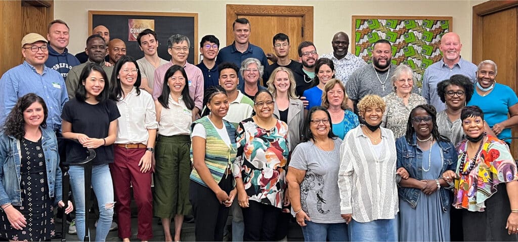 A large group of New York City Navigators smiling for a photo to celebrating their growth in discipleship in the area.