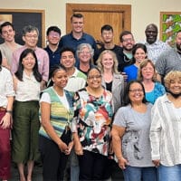 A large group of New York City Navigators smiling for a photo to celebrating their growth in discipleship in the area.