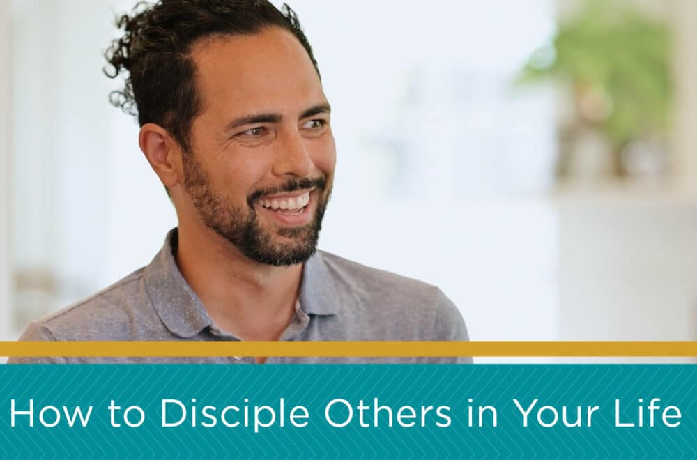 Man smiling in a home setting. There is a blue and gold banner on the bottom of the image with a caption that reads, "How to Disciple Others in Your Life"