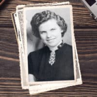 A black and white film photo of Kari Torjesen Malcolm, the first female navigator missionary.