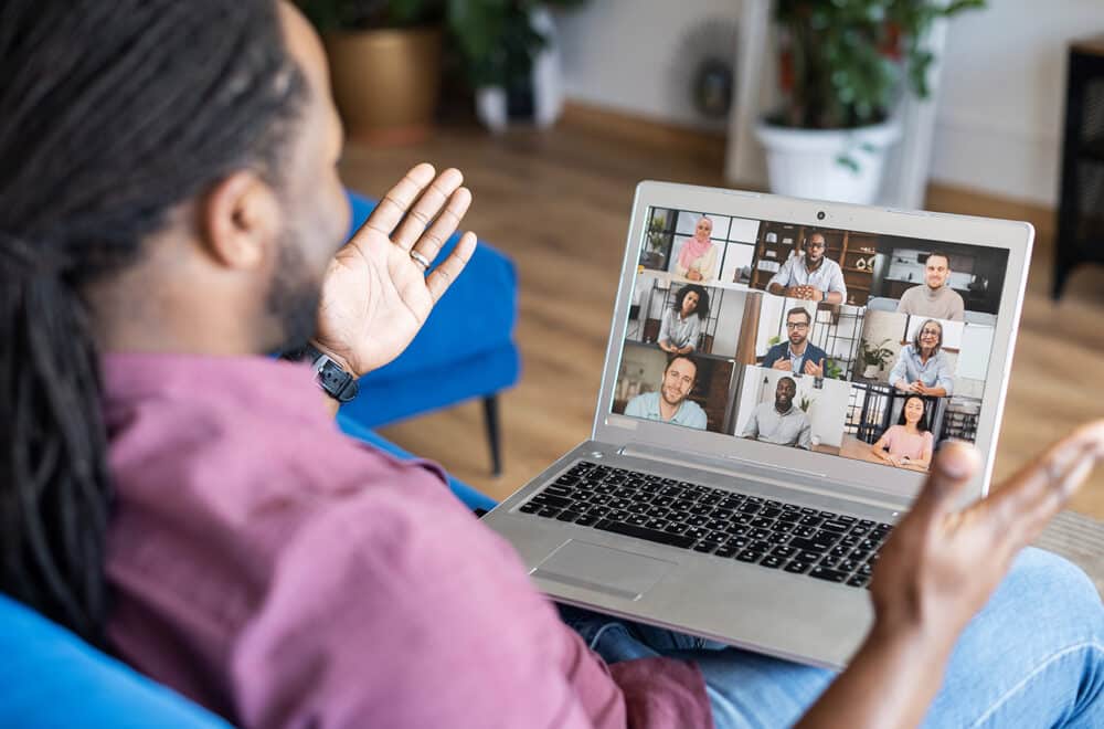 A man on a web call engaging in a discipleship learning community online.