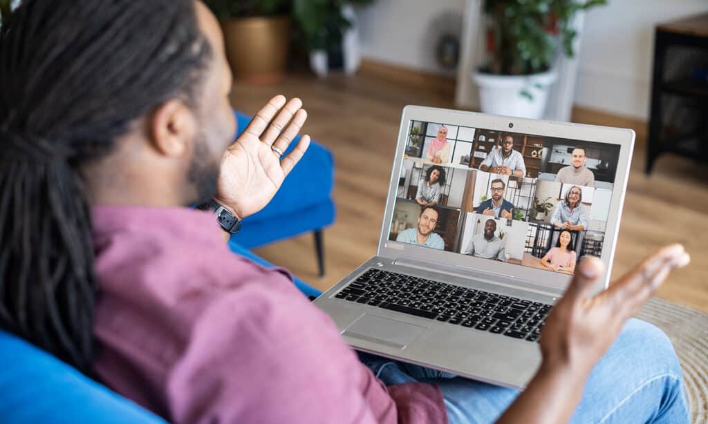 A man on a web call engaging in a discipleship learning community online.