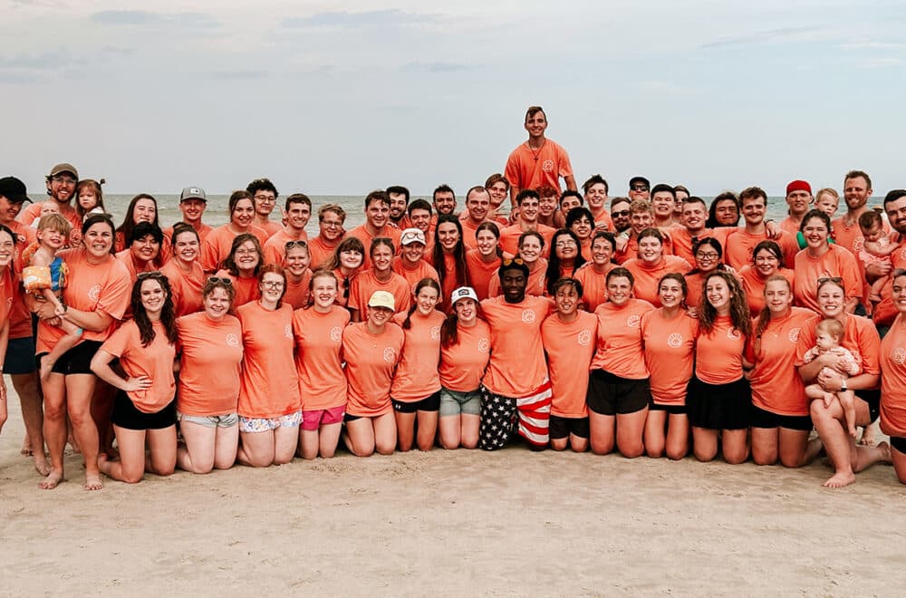 Students pose for a picture on a Jacksonville Beach.