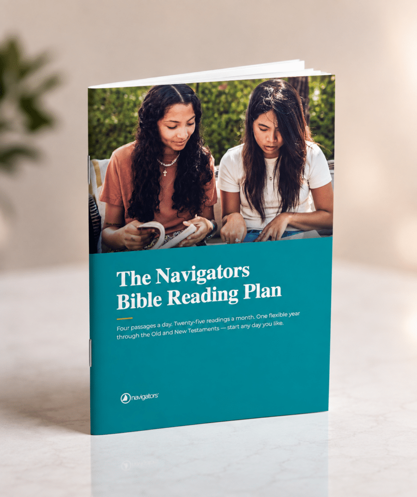 Teal brochure cover titled 'The Navigators Bible Reading Plan' with two women reading outdoors.