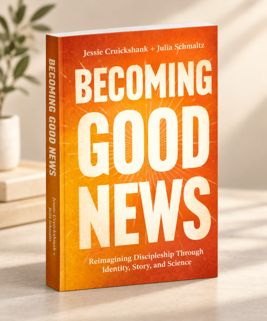 Orange book titled Becoming Good News with author names Jessie Cruickshank + Julia Schmaltz on the cover; subtitle about reimagining discipleship.